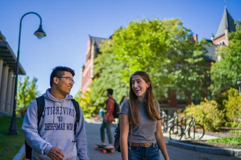 Students walking on campus in the summer